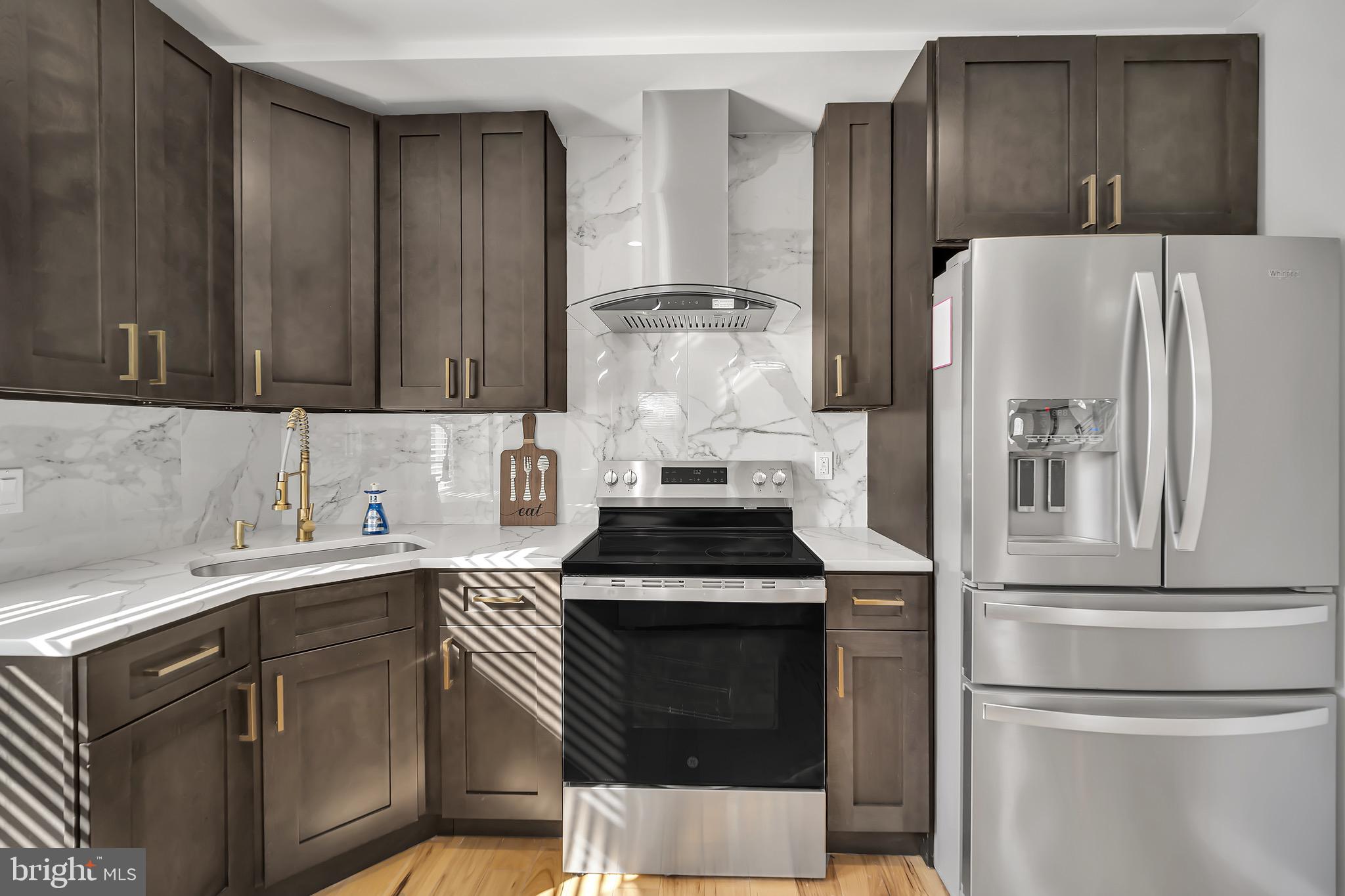 246 Cottage Avenue, Unit B Horsham, PA 19044 - Photo 6 of 19 a kitchen with a refrigerator sink and cabinets