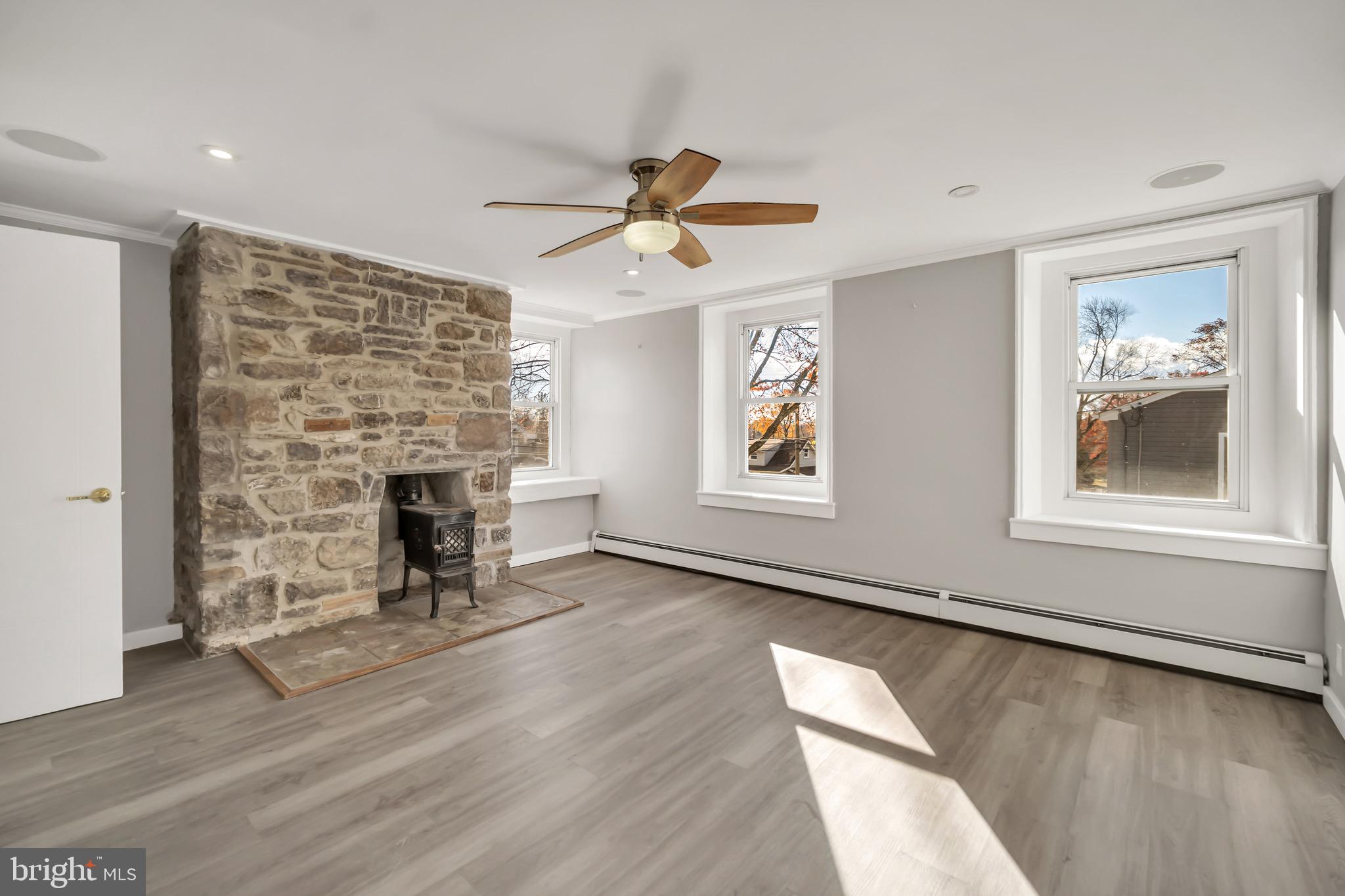 246 Cottage Avenue, Unit B Horsham, PA 19044 - Photo 10 of 19 an empty room with windows and fireplace
