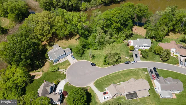 an aerial view of a house with outdoor space and street view