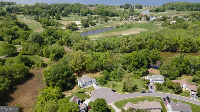 an aerial view of residential house with outdoor space and swimming pool