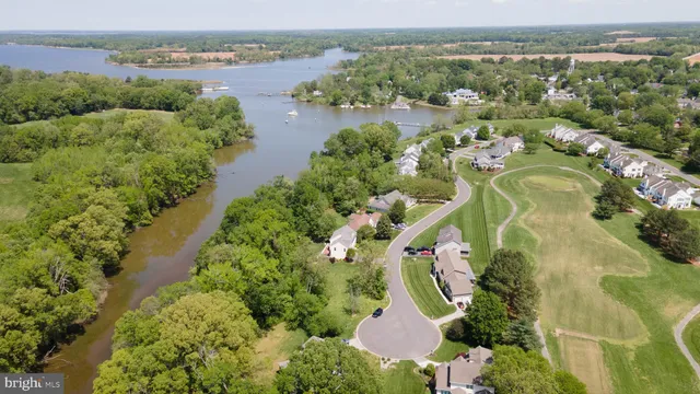 an aerial view of a house with a lake view