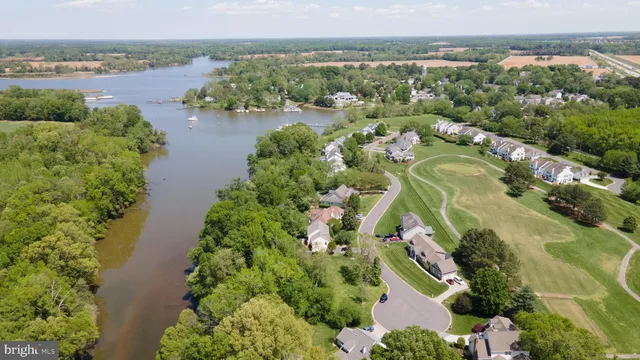 an aerial view of lake residential houses with outdoor space and lake view