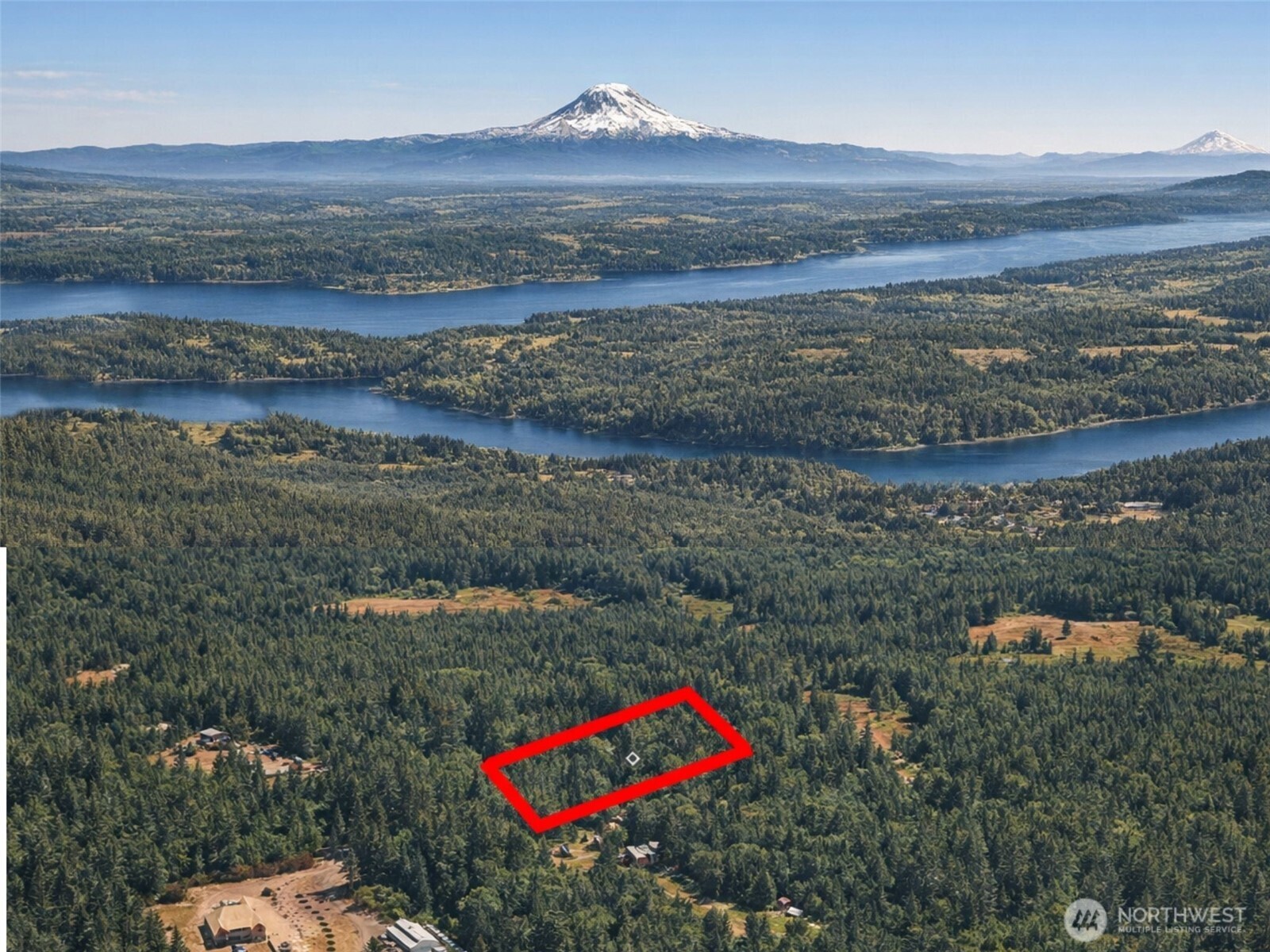 100 East Leffler Lane Grapeview, WA 98546 - Photo 1 of 19 a view of a lake with a mountain