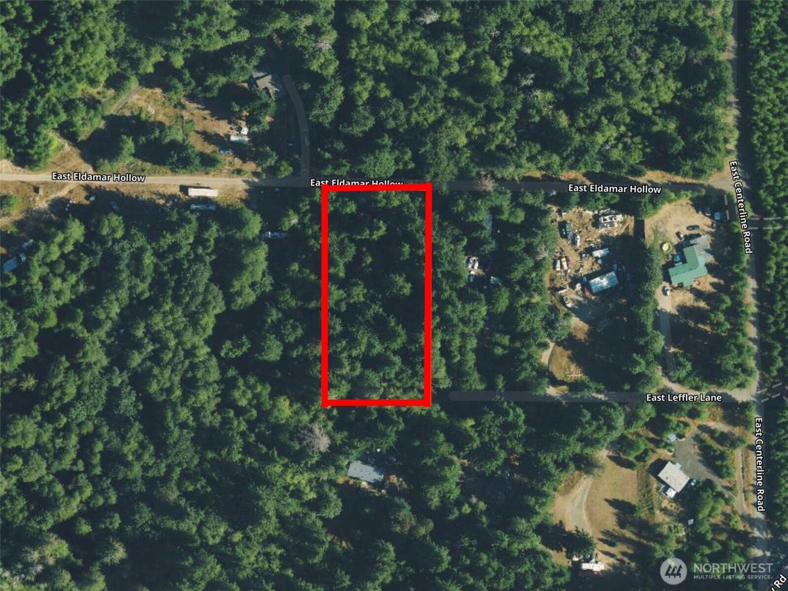 100 East Leffler Lane Grapeview, WA 98546 - Photo 2 of 19 a sign that is sitting in a forest