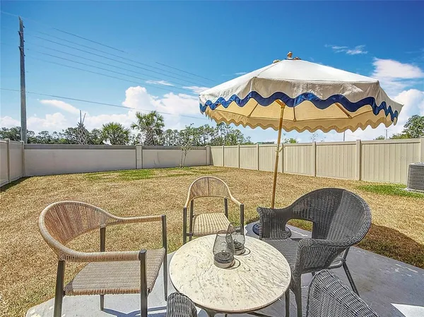 a view of a swimming pool with a lounge chair
