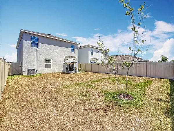 a bathroom with a sink yard and a chandelier