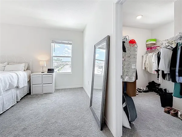 a bedroom with a bed and furniture