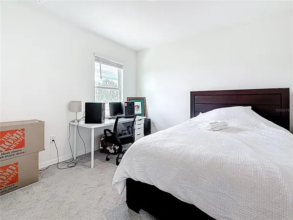 a bedroom with a bed and a cabinets