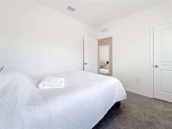 a room with furniture and white walls