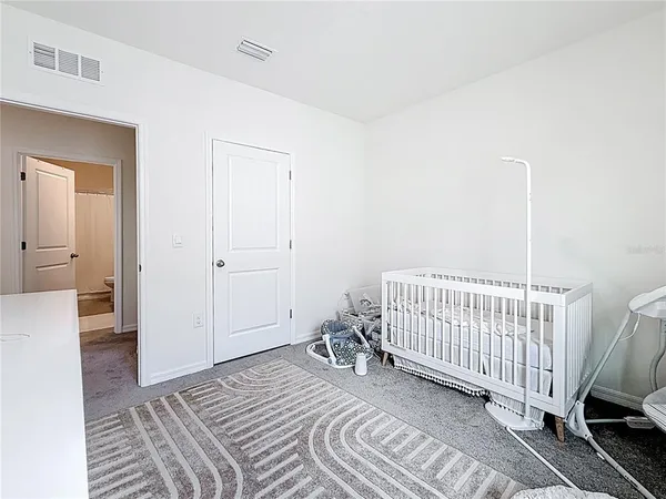a bathroom with a sink vanity and a mirror