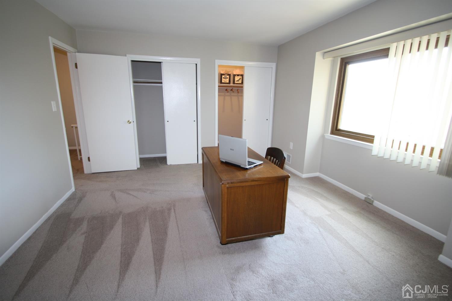 812 Robin Road Hillsborough, NJ 08844 - Photo 15 of 23 a living room with furniture and a window