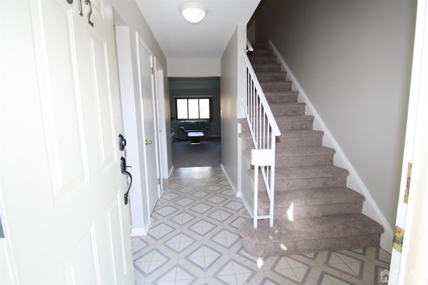 812 Robin Road Hillsborough, NJ 08844 - Photo 17 of 23 a view of a hallway with wooden floor and entryway