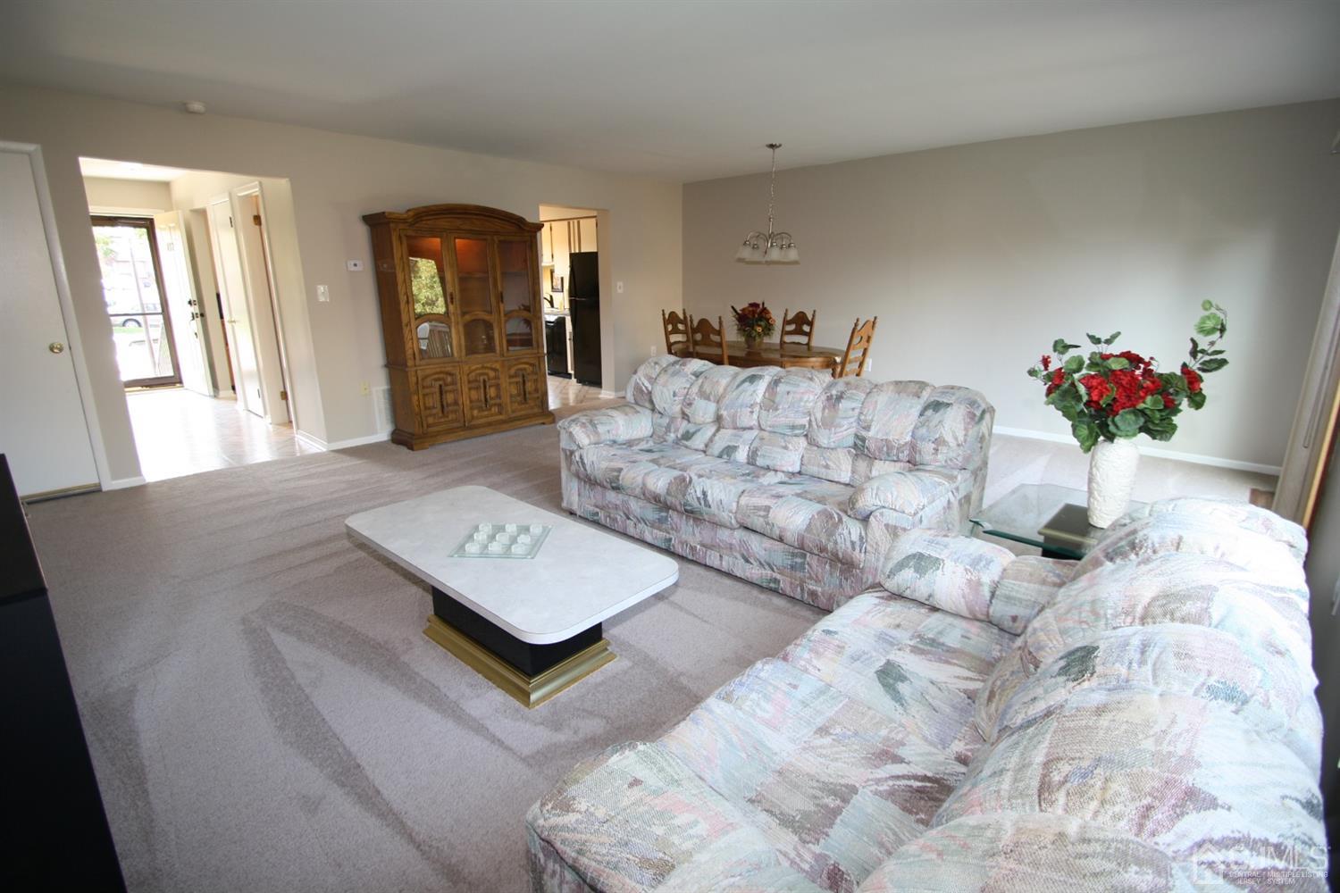 812 Robin Road Hillsborough, NJ 08844 - Photo 3 of 23 a living room with furniture and a potted plant