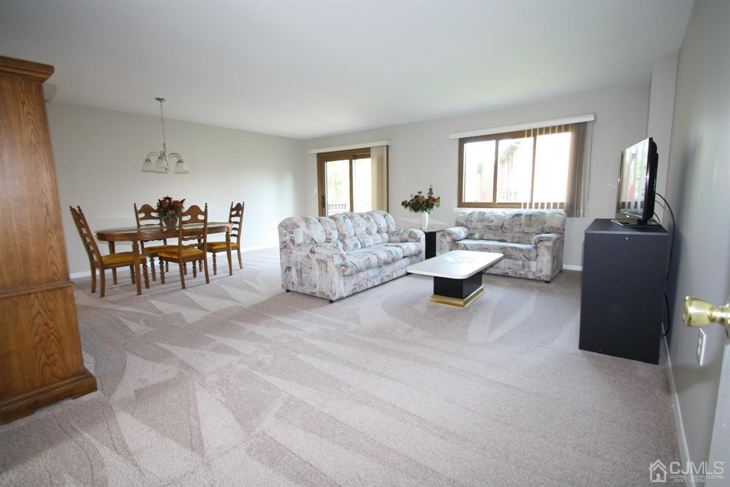 812 Robin Road Hillsborough, NJ 08844 - Photo 4 of 23 a living room with furniture and a window