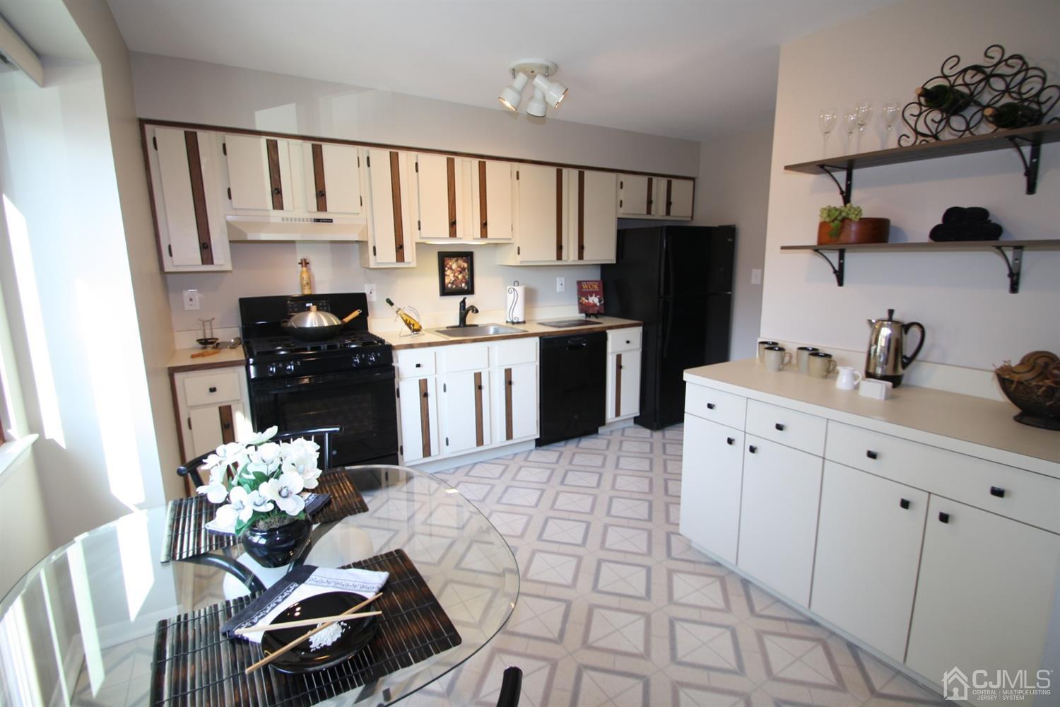 812 Robin Road Hillsborough, NJ 08844 - Photo 8 of 23 a kitchen with granite countertop a refrigerator stove top oven and sink