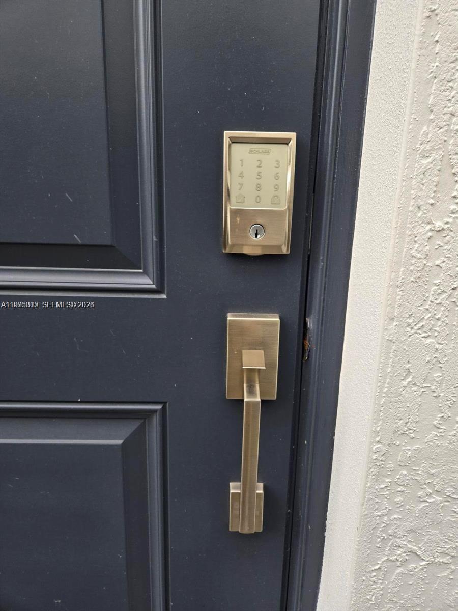 14894 Southwest 163rd Street Miami, FL 33157 - Photo 4 of 15 a close view of door lock