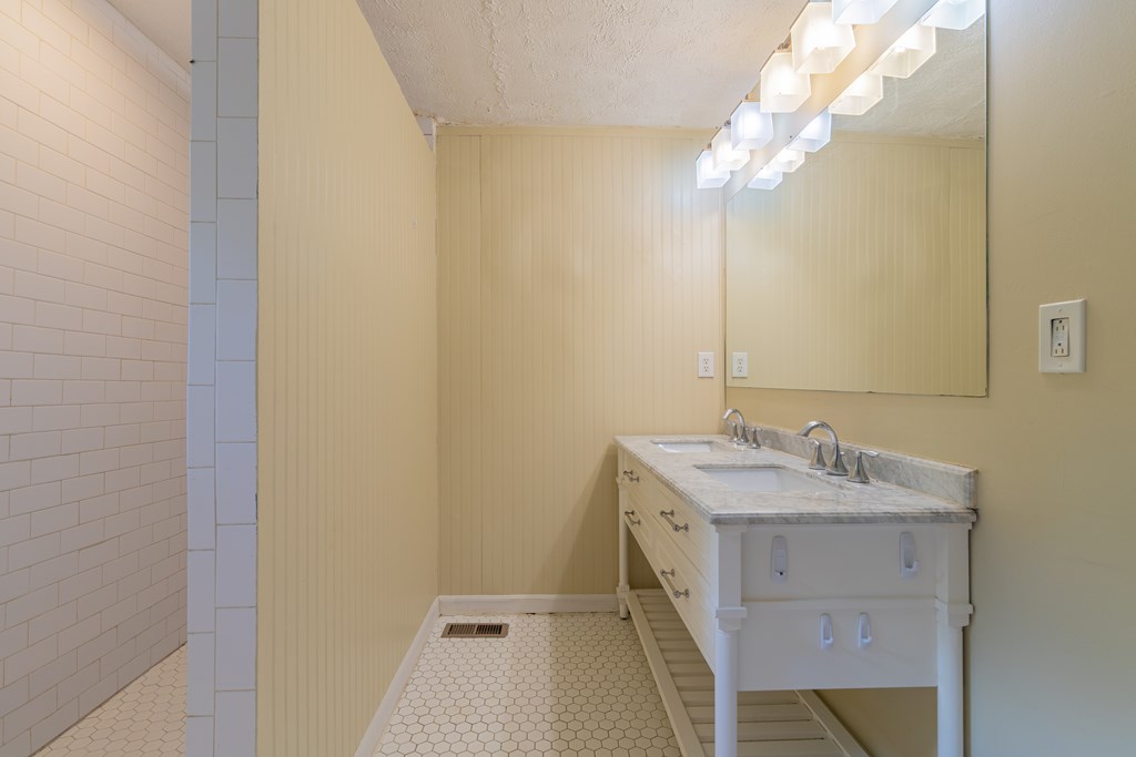 4214 17th Avenue Columbus, GA 31904 - Photo 10 of 15 a bathroom with a sink vanity and a mirror