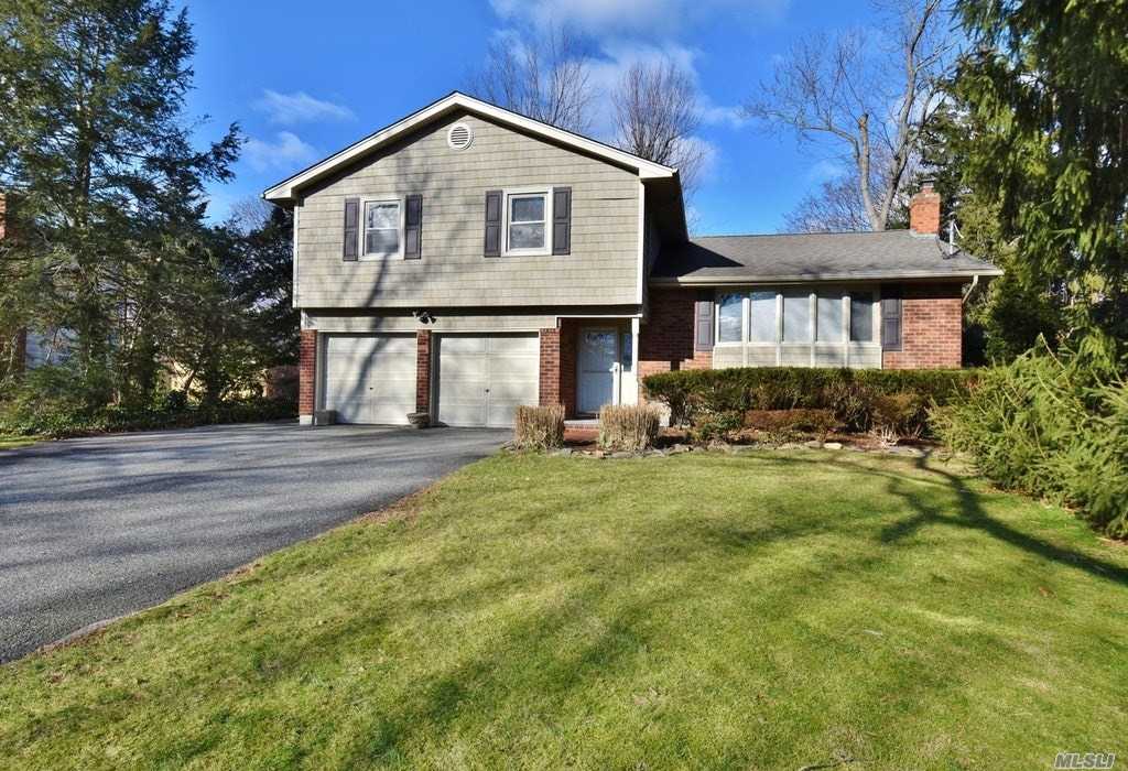 7 Colgate Road Greenlawn, NY 11740 - Photo 1 of 1 a front view of a house with a yard