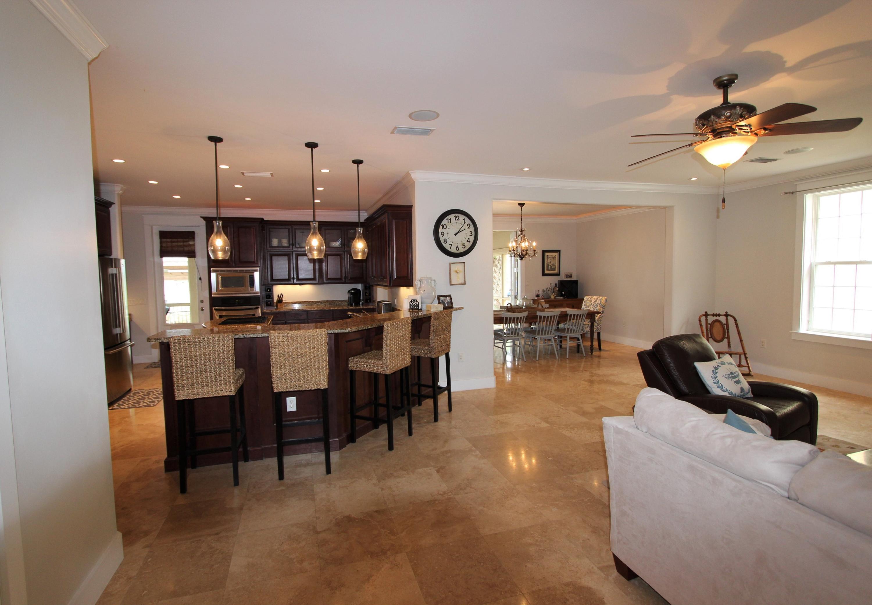 482 West Harborview Road Santa Rosa Beach, FL 32459 - Photo 14 of 48 a view of a dining room with furniture and a chandelier
