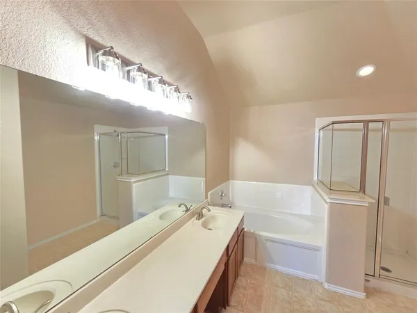 a bathroom with a tub and a sink