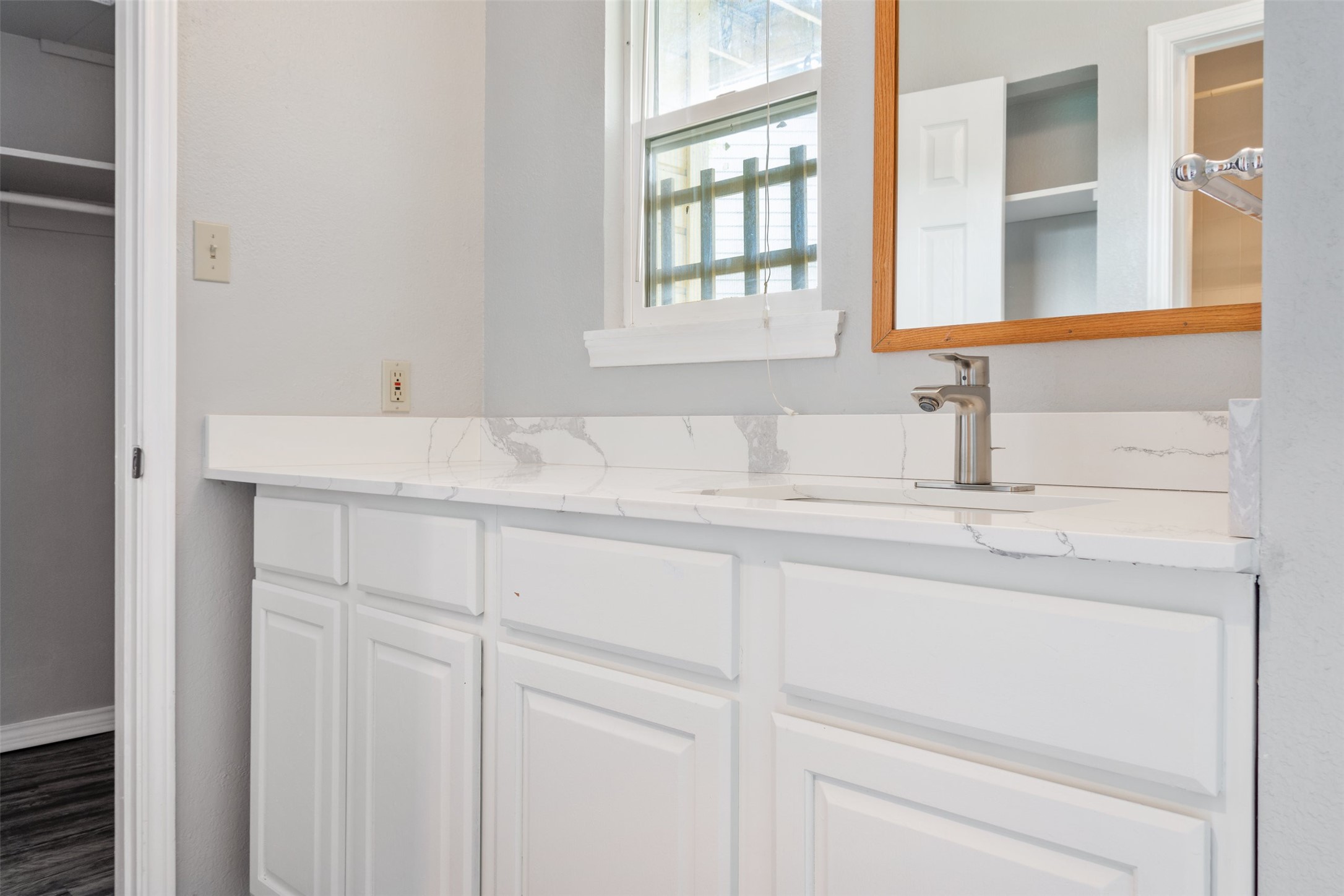 5303 Indio Cove, Unit A Austin, TX 78745 - Photo 13 of 15 a bathroom with a sink and a window