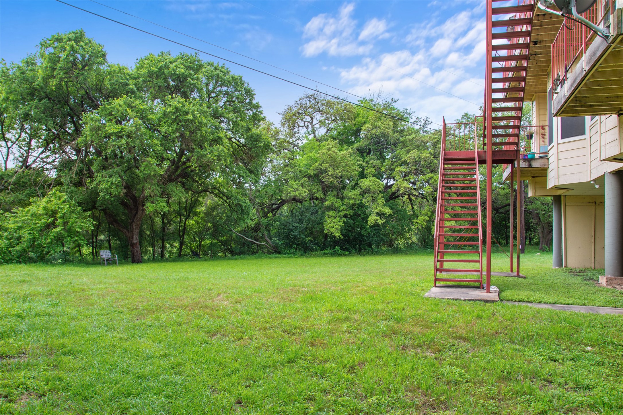 5303 Indio Cove, Unit A Austin, TX 78745 - Photo 15 of 15 a backyard of a house with lots of green space