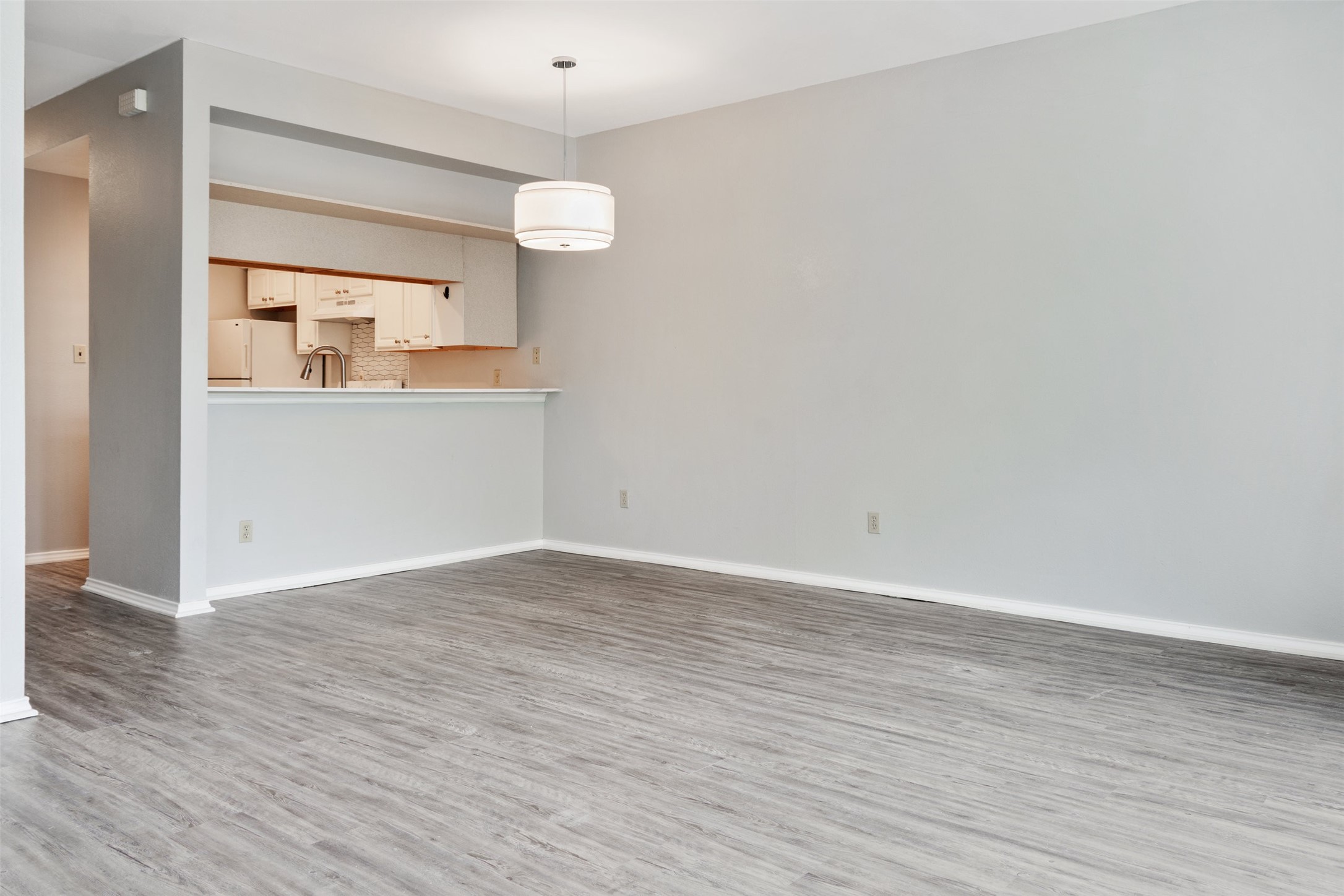 5303 Indio Cove, Unit A Austin, TX 78745 - Photo 5 of 15 a view of a kitchen with wooden floor and a sink