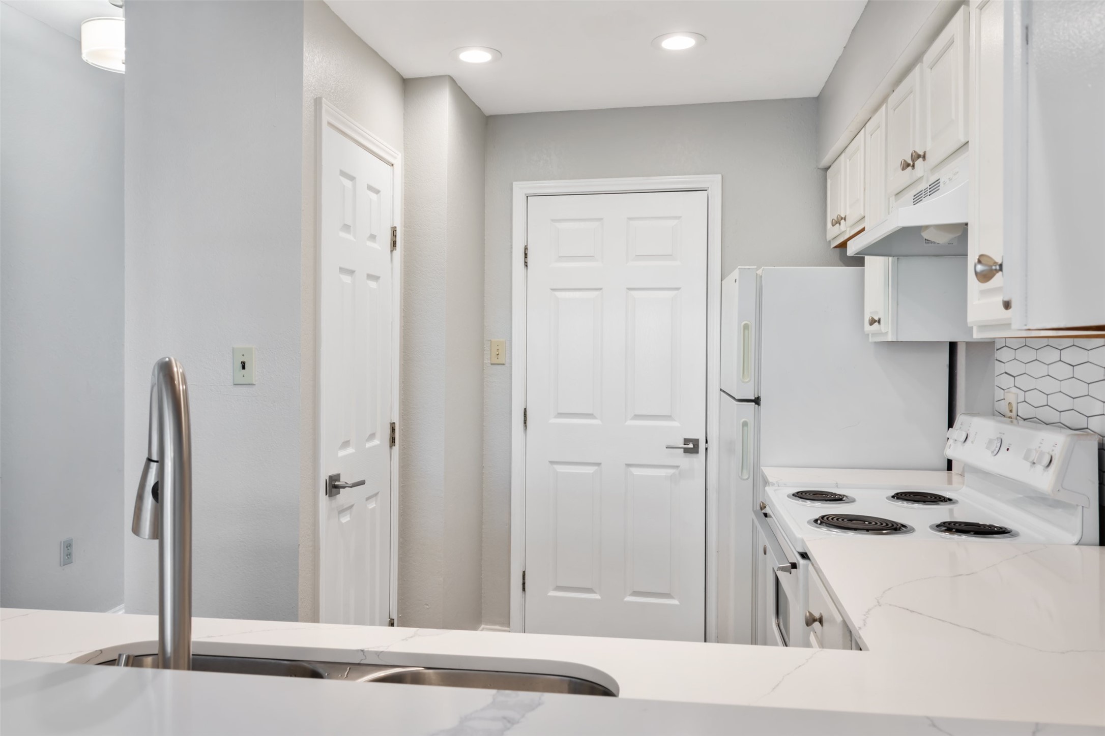 5303 Indio Cove, Unit A Austin, TX 78745 - Photo 6 of 15 a kitchen with stainless steel appliances a refrigerator and a cabinets