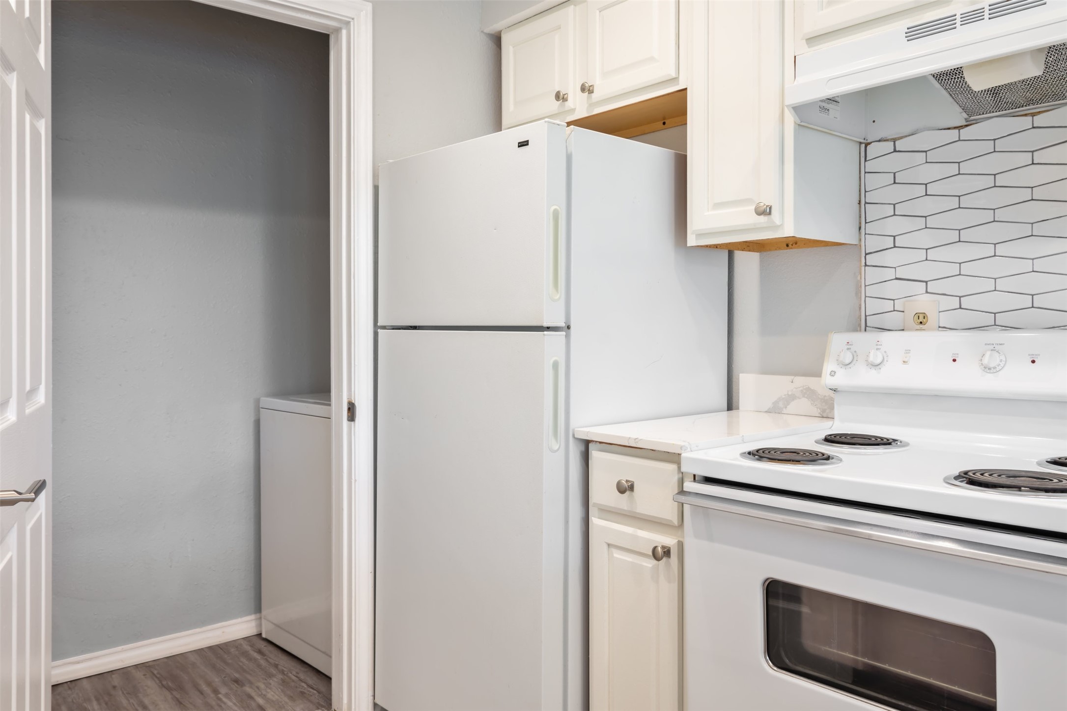 5303 Indio Cove, Unit A Austin, TX 78745 - Photo 8 of 15 a white refrigerator freezer sitting inside of a kitchen