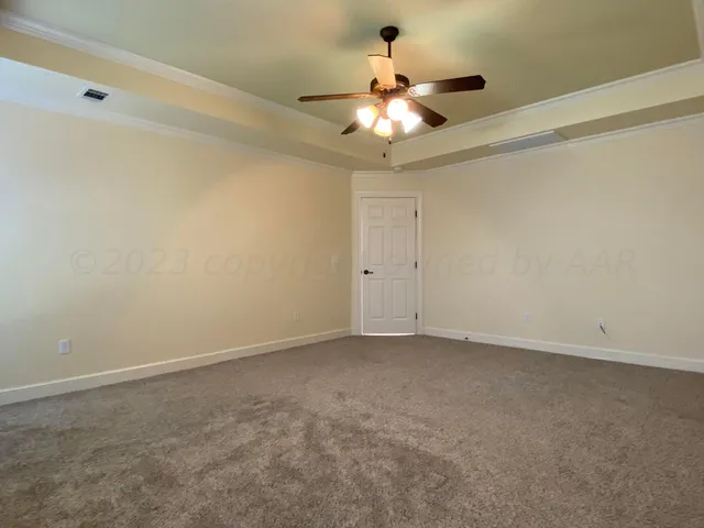 a bathroom with a sink a large mirror and a light fixture