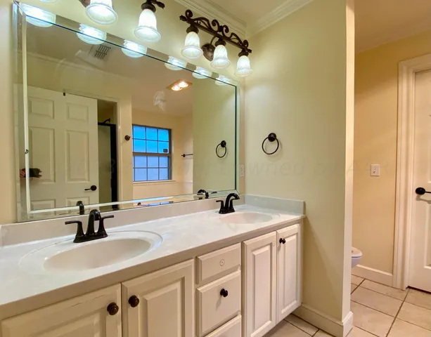 a bathroom with a bathtub and next to a window