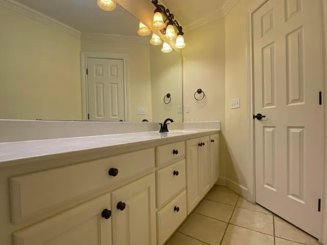 a bathroom with a toilet a sink and shower