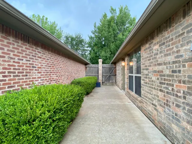 a backyard of a house with lots of green space
