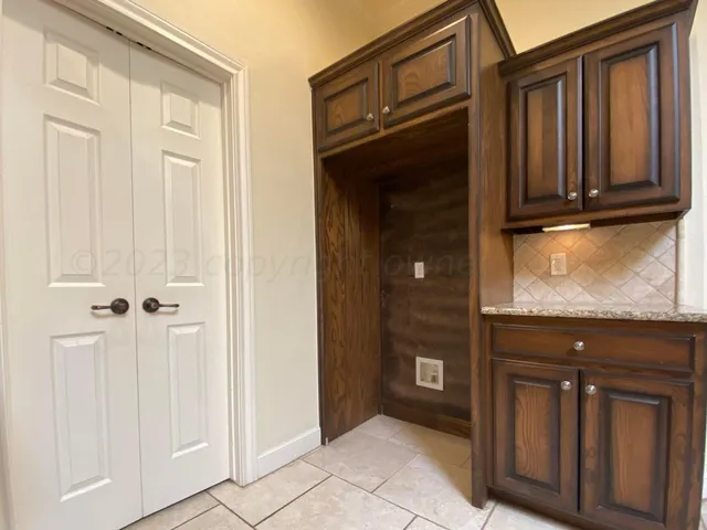 a bathroom with a sink vanity and a mirror