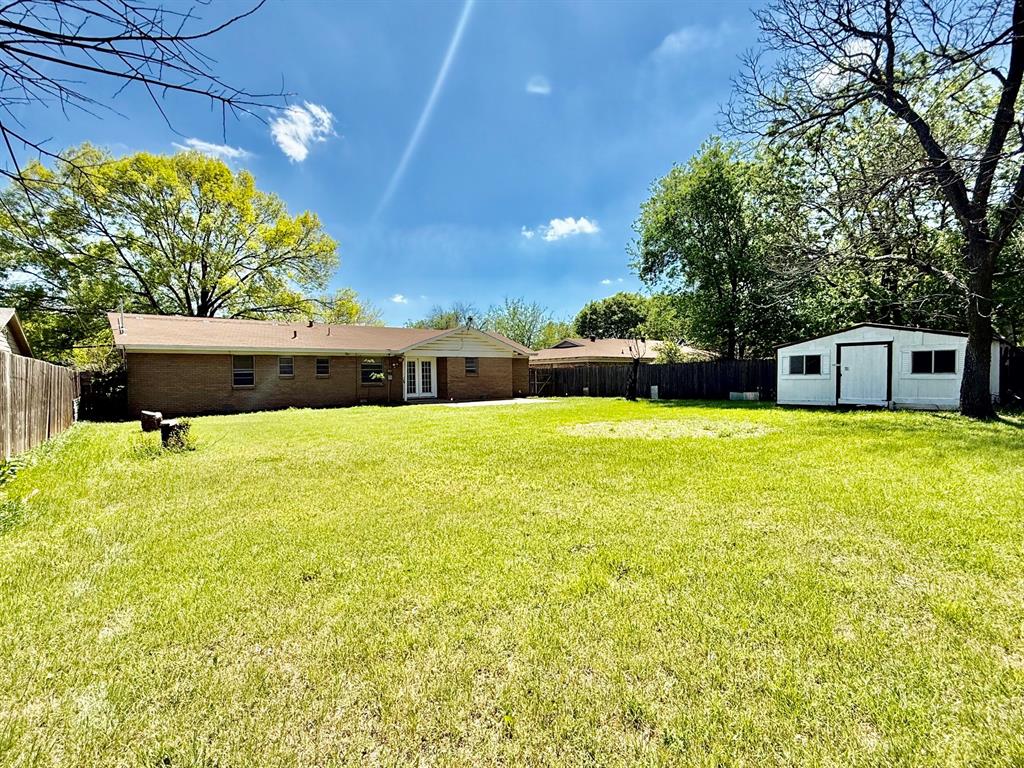1114 Davis Street Cleburne, TX 76033 - Photo 16 of 17 a swimming pool with trees in front of it
