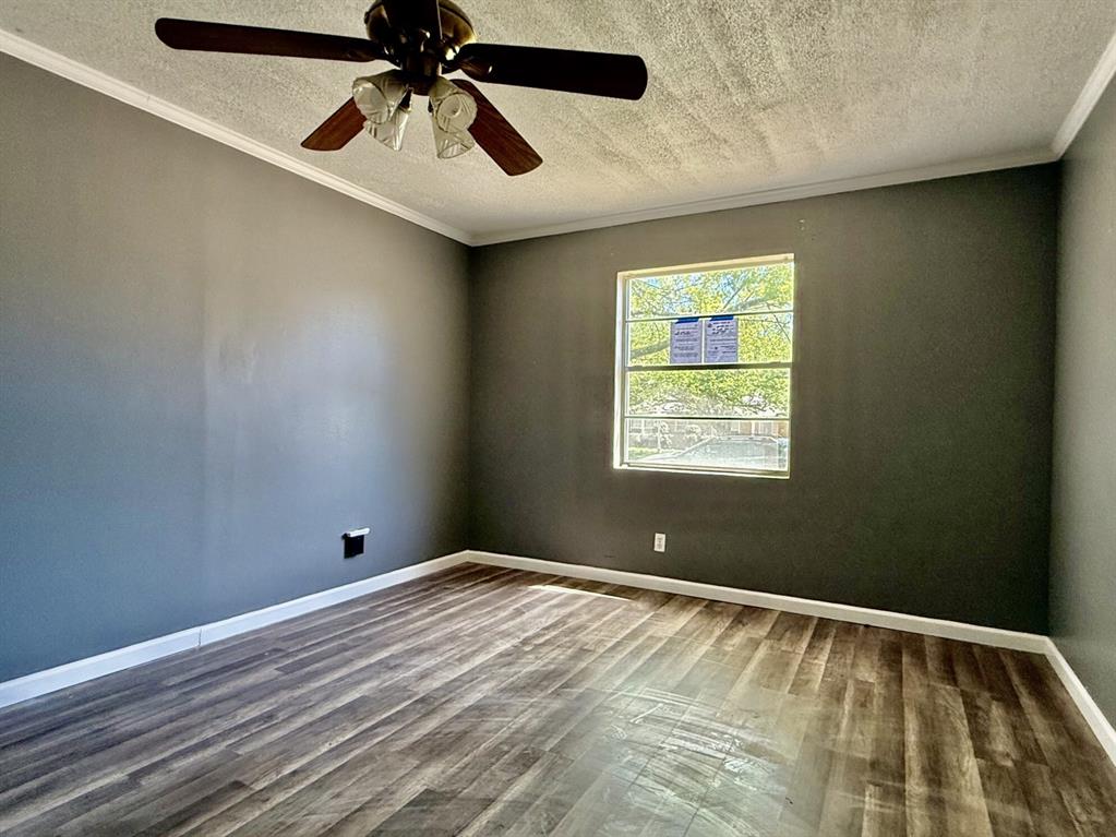 1114 Davis Street Cleburne, TX 76033 - Photo 2 of 17 a view of an empty room and window