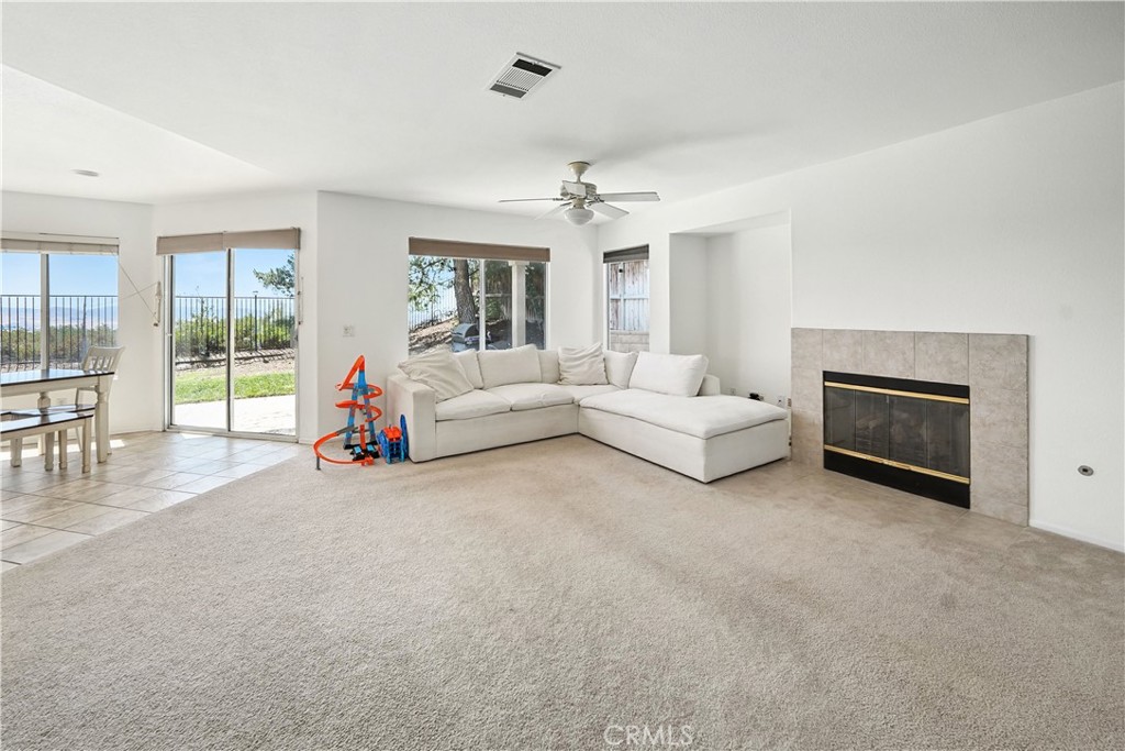 32610 Ridge Top Lane Castaic, CA 91384 - Photo 12 of 47 a living room with furniture and a fireplace