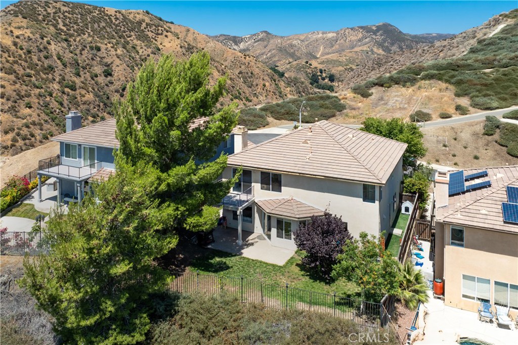 32610 Ridge Top Lane Castaic, CA 91384 - Photo 22 of 47 an aerial view of a house with a big yard