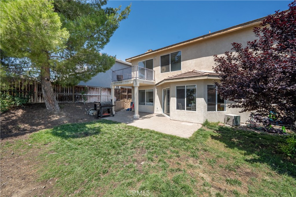 32610 Ridge Top Lane Castaic, CA 91384 - Photo 25 of 47 a front view of a house with garden and porch