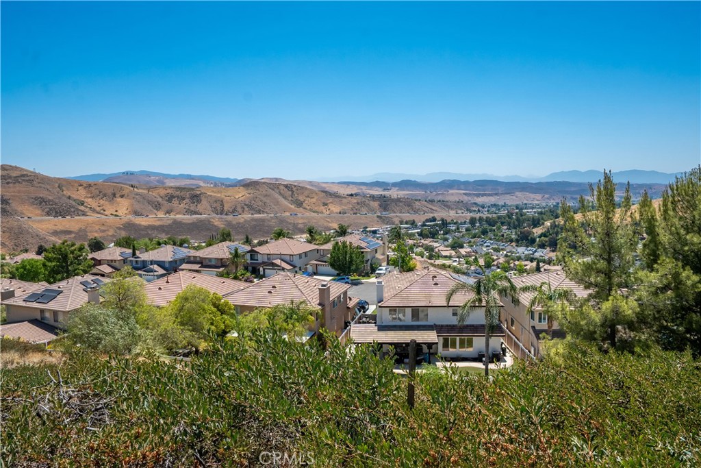 32610 Ridge Top Lane Castaic, CA 91384 - Photo 27 of 47 a view of a house with a mountain in the background