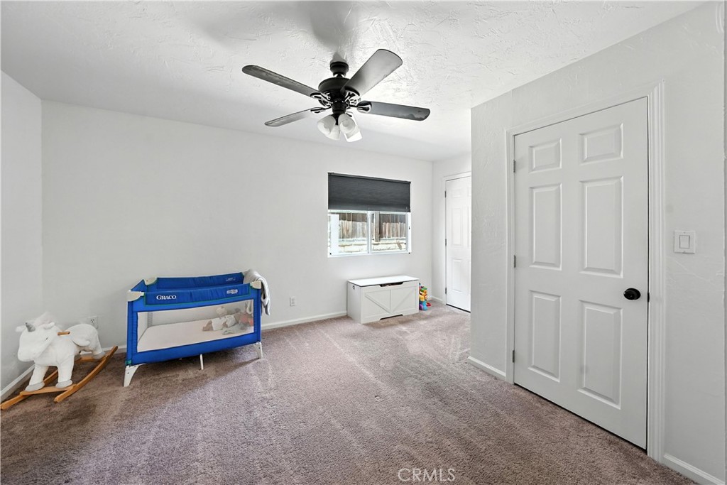 32610 Ridge Top Lane Castaic, CA 91384 - Photo 28 of 47 a living room with furniture and a ceiling fan