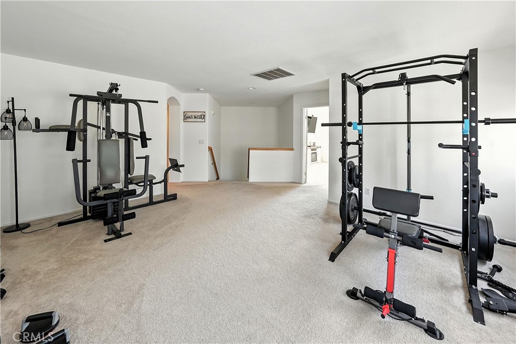 32610 Ridge Top Lane Castaic, CA 91384 - Photo 33 of 47 a view of a room with gym equipment