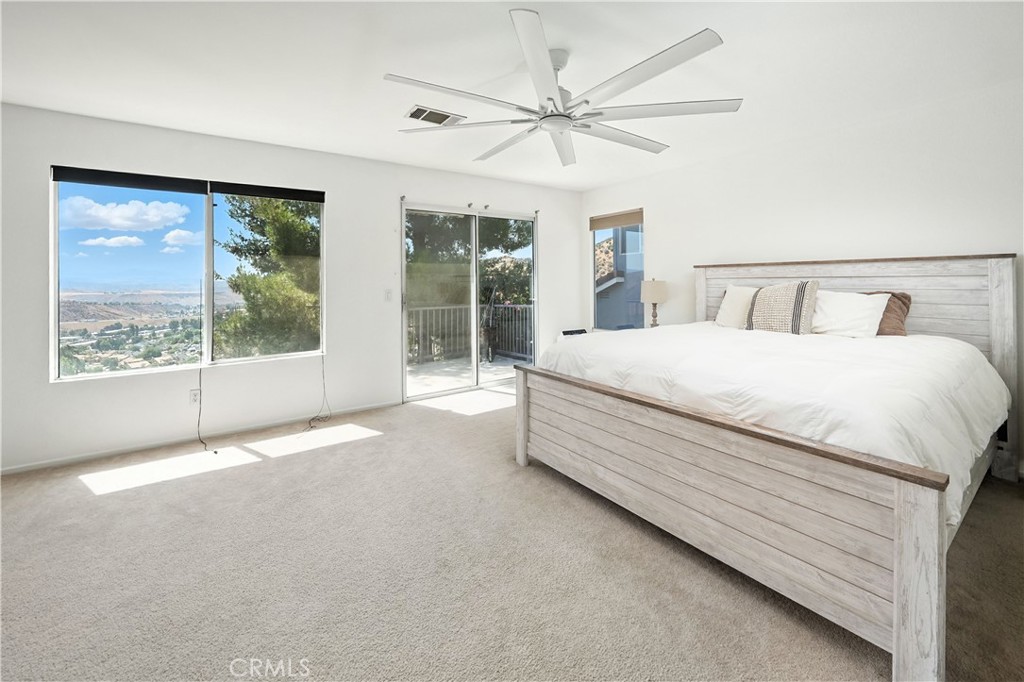 32610 Ridge Top Lane Castaic, CA 91384 - Photo 34 of 47 a spacious bedroom with a large bed and a large window