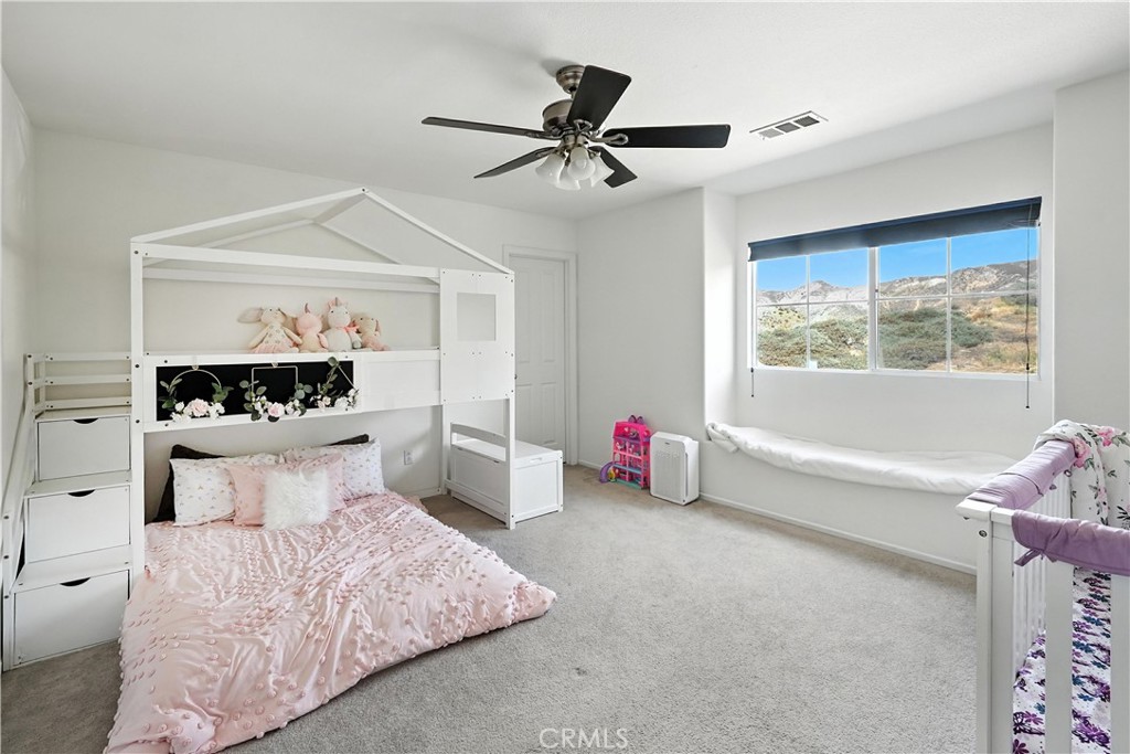 32610 Ridge Top Lane Castaic, CA 91384 - Photo 39 of 47 a bedroom with a bed and a window