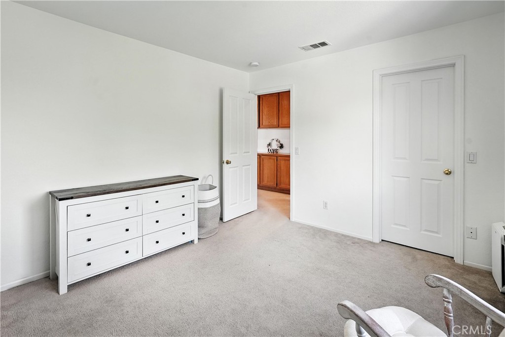 32610 Ridge Top Lane Castaic, CA 91384 - Photo 42 of 47 a view of room with cabinet and mirror
