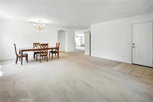 a view of a livingroom with furniture and chandelier
