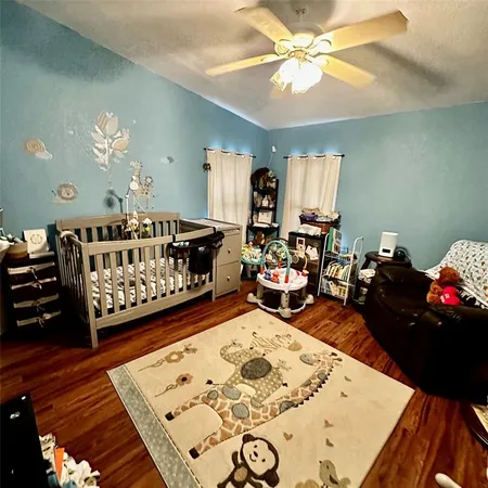 a bed room with furniture and a window