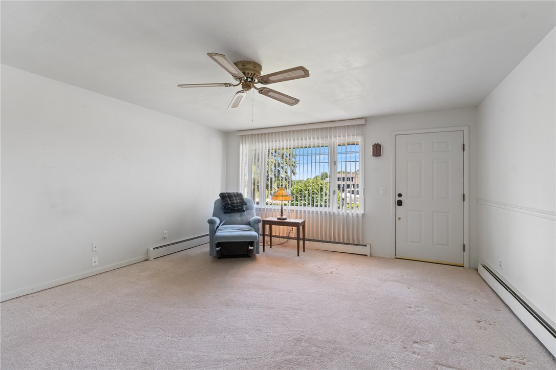 6075 Arbor Road Ontario, NY 14519 - Photo 15 of 27 Living room with front entrance door to the right.