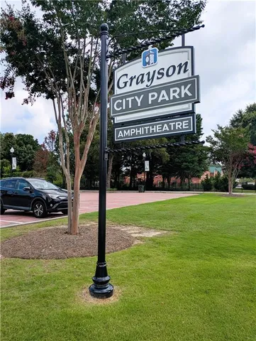 a front view of a house and a big yard
