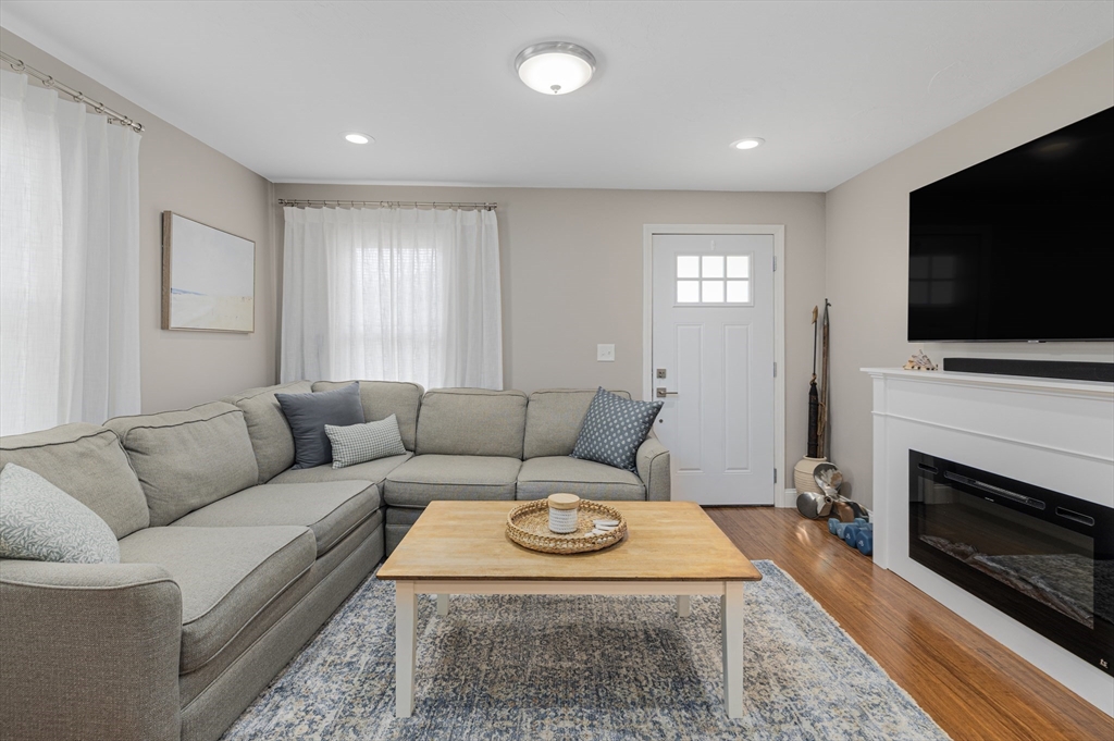 69 Denver Street Fall River, MA 02721 - Photo 20 of 35 a living room with furniture a flat screen tv and a fireplace
